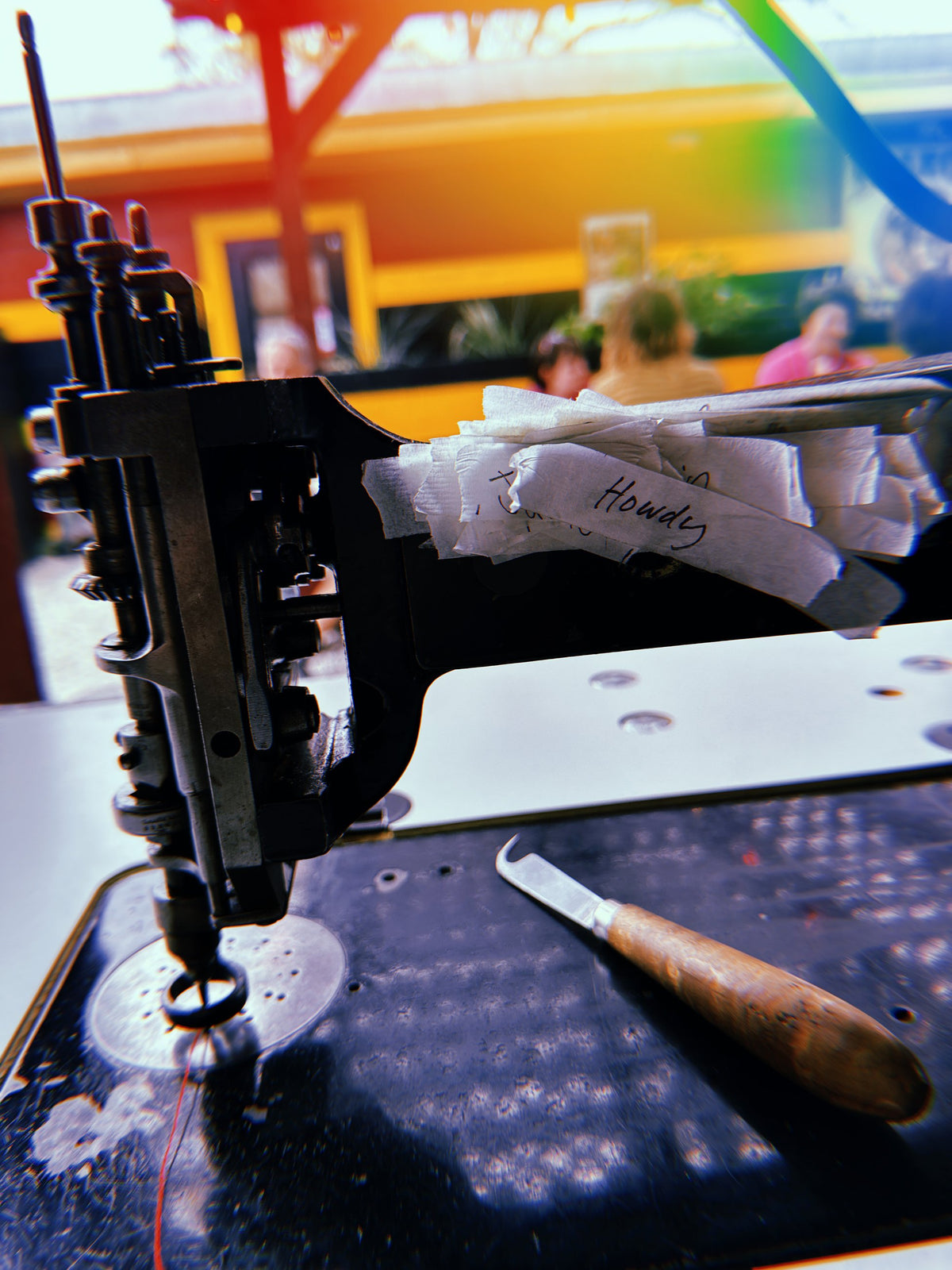 Chainstitch machine catching a rainbow of light