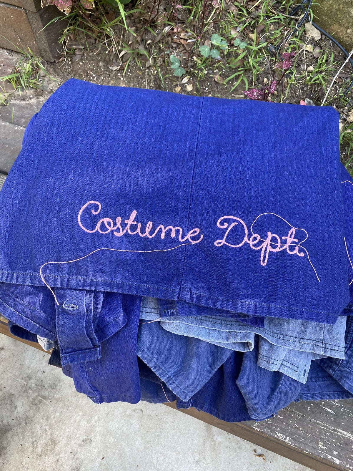 Costume Dept. chainstitched on blue workwear