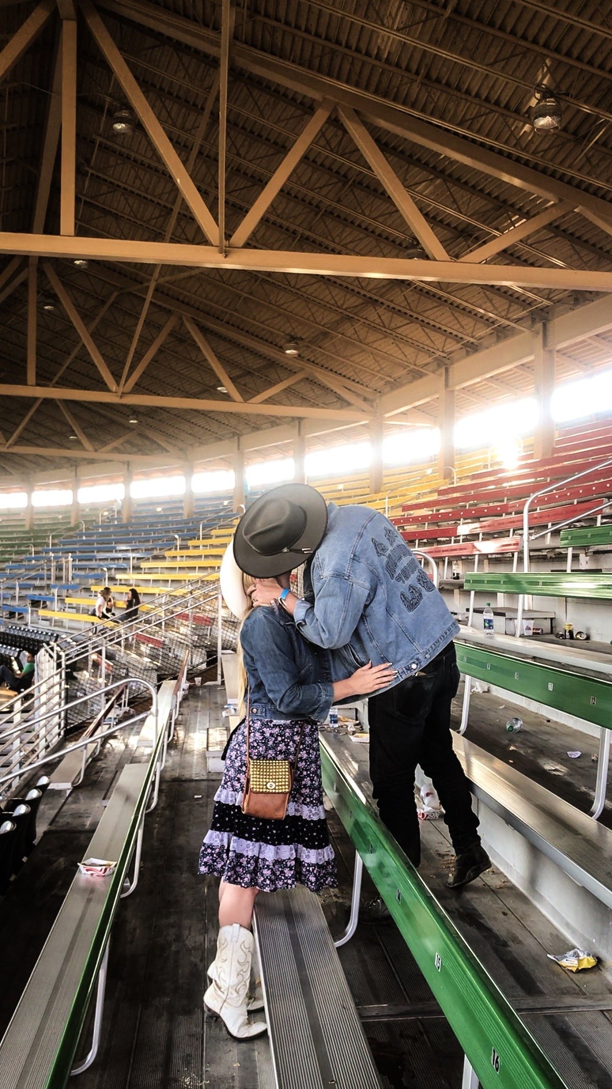 Jada and Jon kissing in the bleachers